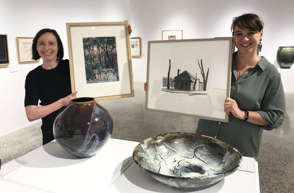 Up for grabs: Emma Collerton and Jo Dicksen show off some of the fabulous prizes by local artists at the forthcoming BRAGS cocktail evening.