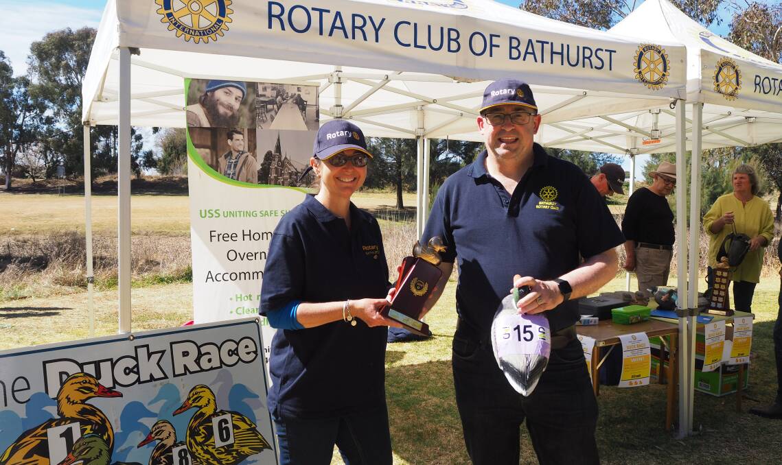 FIRST PAST THE POST: Rotary Club of Bathurst's Sharyn and Steve Semmens with the winning corporate duck race entry from Inland Digital. Photo: SAM BOLT