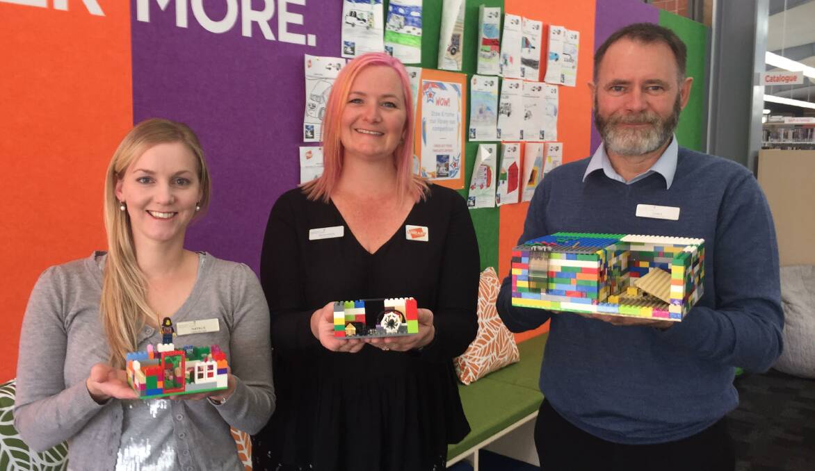 BUILDING BLOCKS: Bathurst Library outreach team Natalie Conn, Rhiannon Mijovic and Chris Halpin with some Lego Club creations.