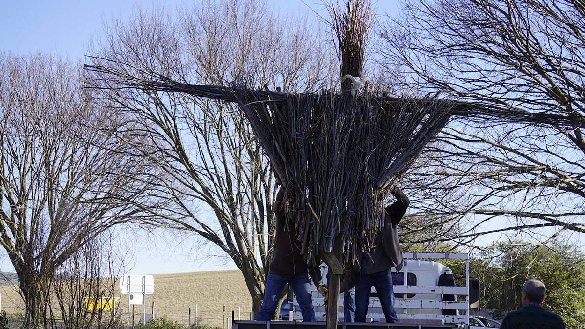 WINTER PYRE: Newbridge Winter Solstice Festival organisers preparing the wicker man for the fire during last year's event. Photo: SUPPLIED
