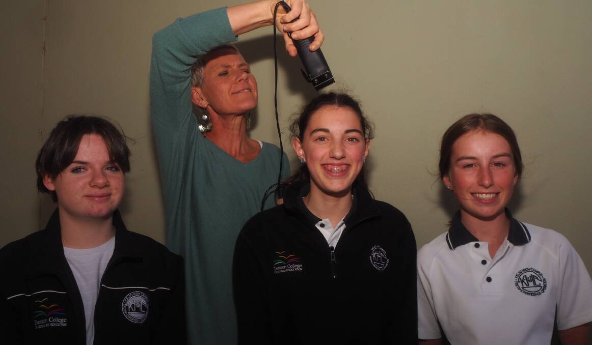 BRAVING A SHAVE: Kelso High Campus students Ava Burns, Georgia and Rosie Butler and teacher Jude Murphy [with the clippers] are taking part in World's Greatest Shave on July 1. Photo: SAM BOLT