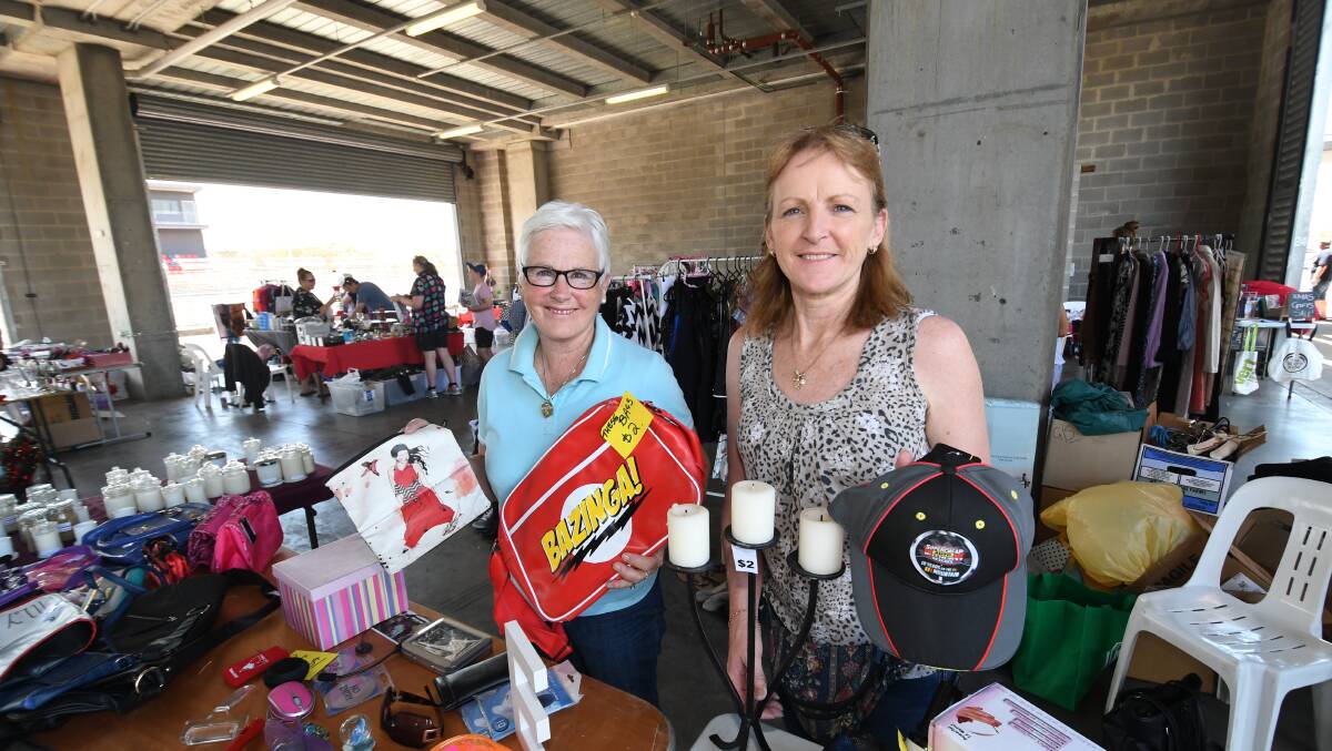 ENDLESS POSSIBILITIES: Anne Butler and Paula Horton at their stall during last year's Bathurst Community Garage Sale at Mount Panorama. Photo: CHRIS SEABROOK
