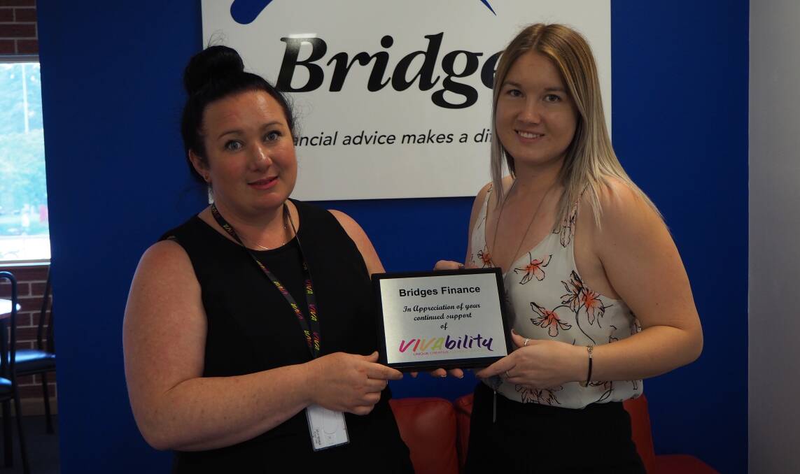 INTERVIEW SKILLS: Vivability community access manager Ruth Thurtell presenting a plaque of appreciation to Bridges Financial Services personal assistant Andalee Upton. Photo: SAM BOLT 122118sbviva2