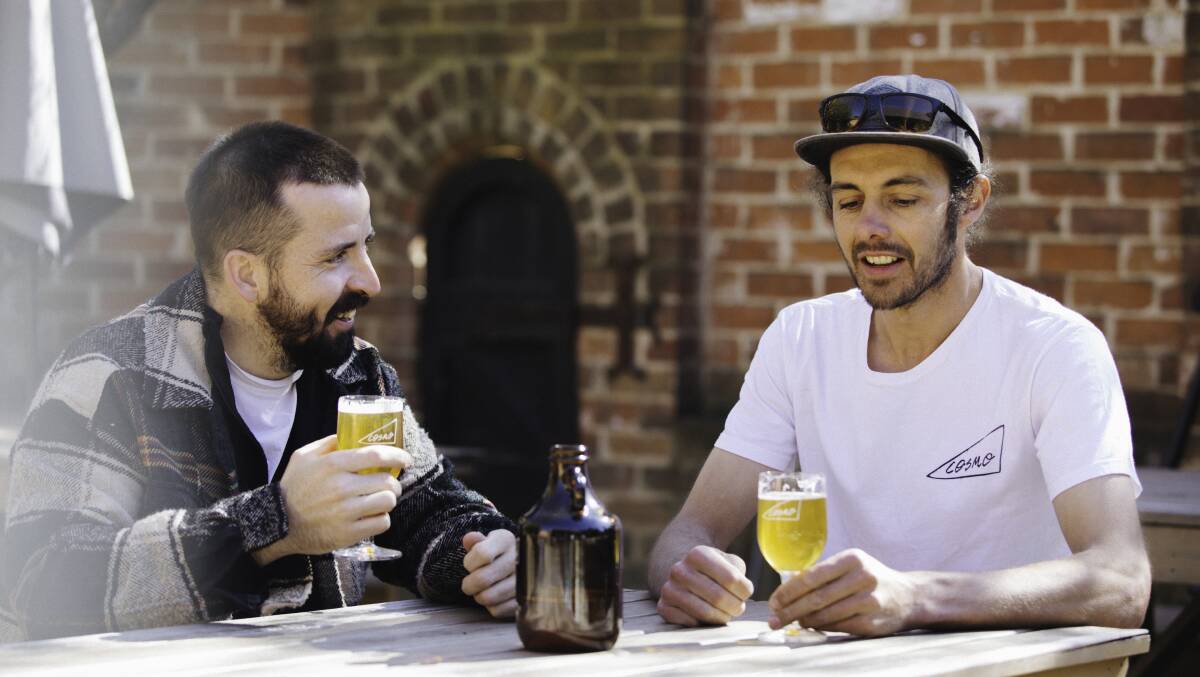 CHEERS: Cosmo Brewing's Ian Carman [right] shares a brew with Henry Simmons at the Church Bar. Photo: RIBBON GANG MEDIA AGENCY
