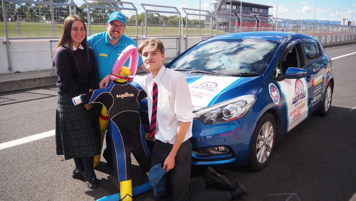 DRIVEN: Calare Academy Road Safety director Matthew Irvine with Scots All Saints College Year 11 students Meg Davis and James Van Ryn.