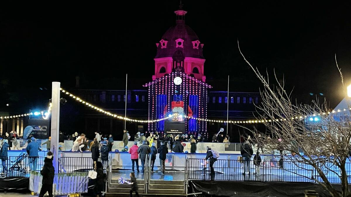 Crowds flock to the ice rink on the Bathurst Winter Festival's opening night in the shadow of the Bathurst Court House, which has returned to the illuminations setup for the first time since 2020. Picture: Sam Bolt