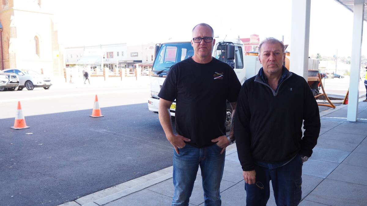 FED UP: O'Shea Barber Shop Owner John O'Shea and Ristretto owner Arthur Aube have expressed frustration towards works to finish off the roundabout at the intersection of Howick and George streets. Photo: SAM BOLT