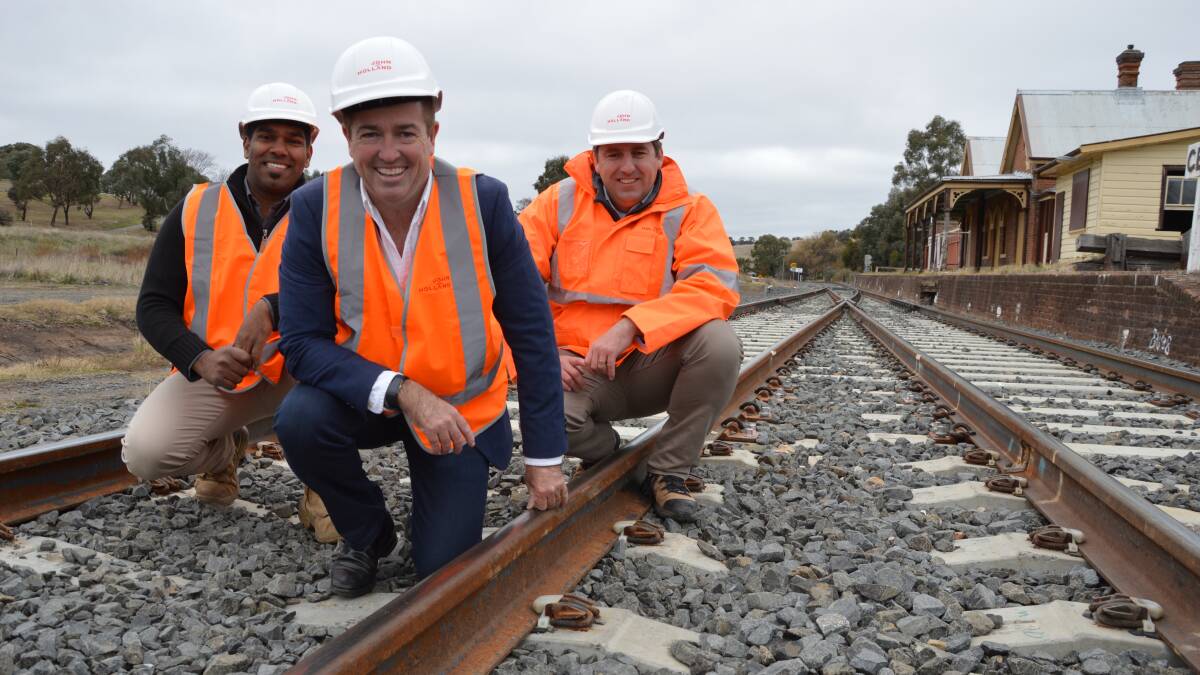 ON TRACK: State member for Bathurst Paul Toole [centre] with John Holland Rail's Wayne D'Souza and Tim Halloran. 
