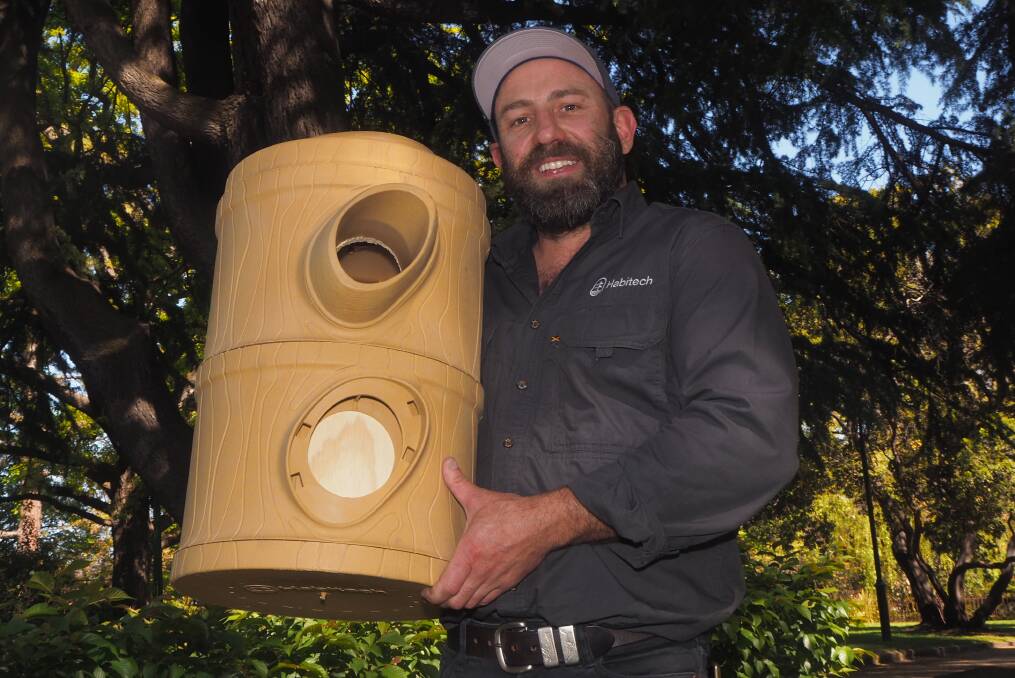 ANIMAL HOUSE: Habitat Innovation and Management director Mick Callan with a locally designed and made Habitech nest box. Photo: SAM BOLT