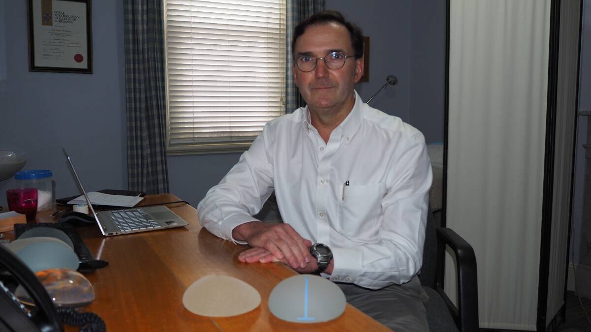 PIONEER: Bathurst surgeon Dr Neil Meulman with the nano-textured breast implant [right] he is recommending over the standard textured implant [left]. Photo: SAM BOLT