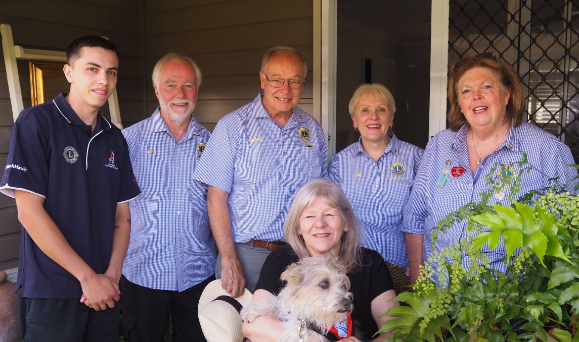 KINDNESS: Gail Francis and 'Raffles' [front] with Australian Lions Hearing Dogs' trainer Marcello Romeo and Bathurst Macquarie Lions Club members Jon MacLean, Michael Ryan, Judy Ryan and Sue Longmore. Photo: SAM BOLT