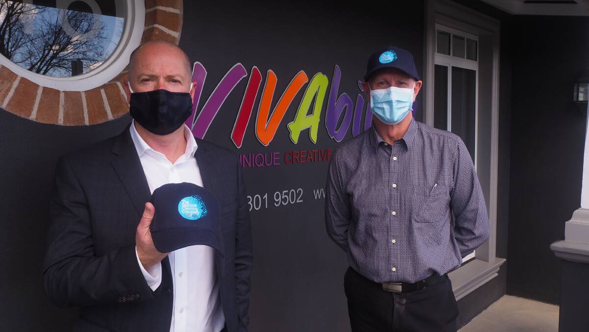 MORE JOBS: Vivability chief executive officer Nick Packham with The Bathurst Cleaning Company manager Stephen Harper. Photo: SAM BOLT