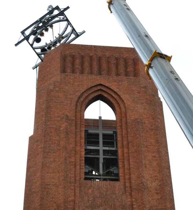FOR WHOM THE BELL TOLLS: A brand new set of bells being lowered into the Bathurst War Memorial Carillon yesterday. Photo: SAM BOLT 112718sbbell1 