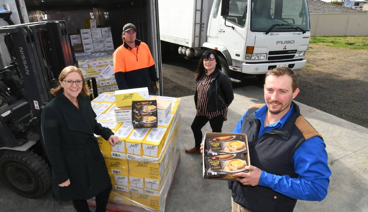 FOOD BANK: FRCW ambassador Kate Bracks, The Junktion manager Justin Fowler, The Greens on William manager Rebecca Mathie and Hope Care operations and welfare services manager Elliot Redwin. Photo: CHRIS SEABROOK