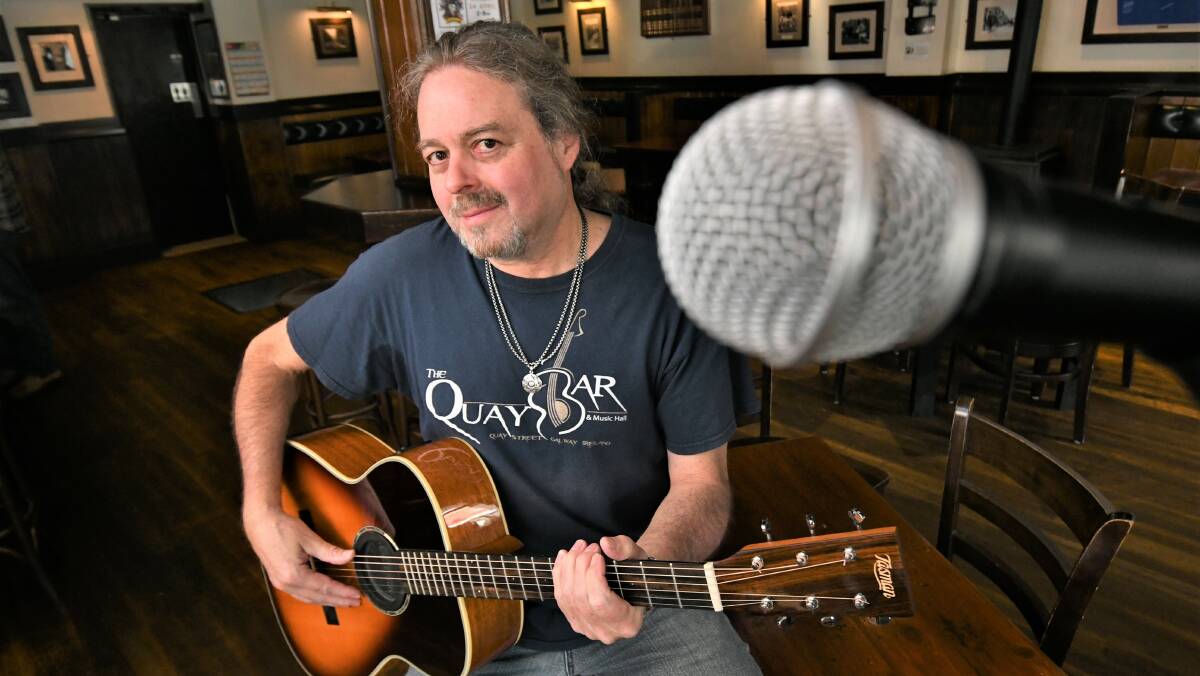 HAVE A GO: Musician Cletis Carr at Jack Duggans Irish Pub, promoting upcoming Wednesday open mic sessions. Photo: CHRIS SEABROOK 033022cmikeopen