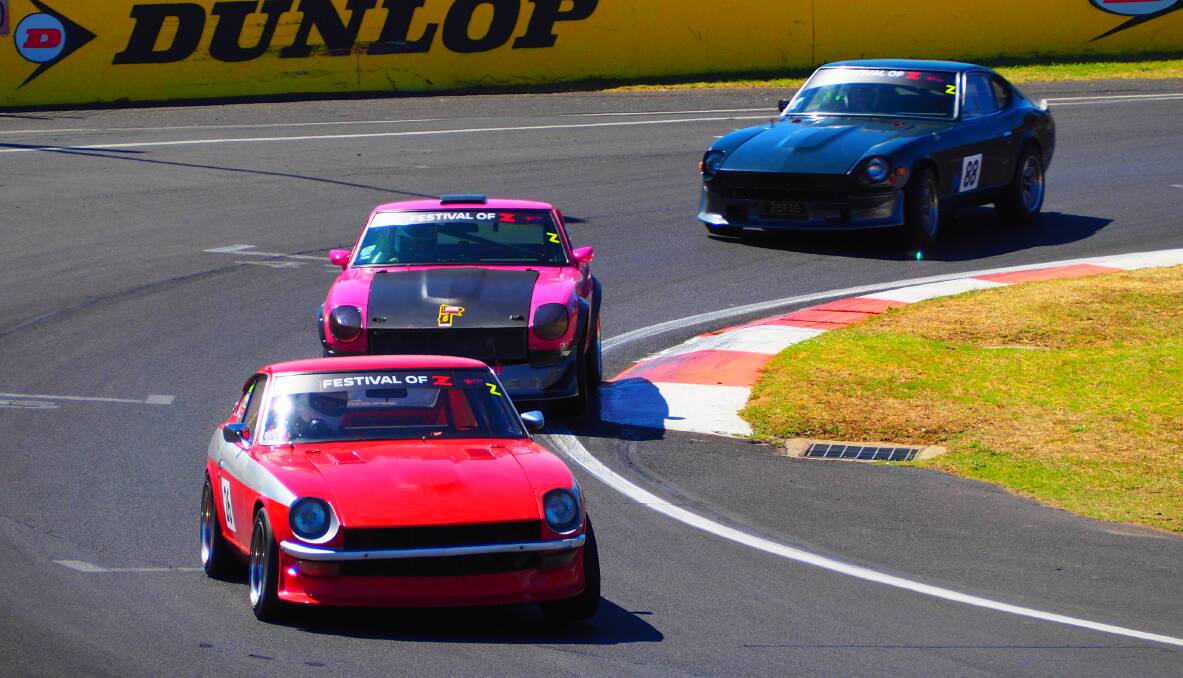 IN FORMATION: Members of Queensland's Z Car Club steer Datsun 240Z's around Murrays Corner during Challenge Bathurst's regularity section yesterday. Photo: SAM BOLT