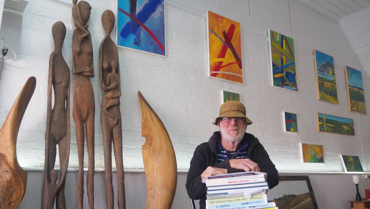 MAN OF MANY TALENTS: Local artist Jim Turner with some of his artworks and published books at Velvet Buzzsaw Gallery. Photo: SAM BOLT