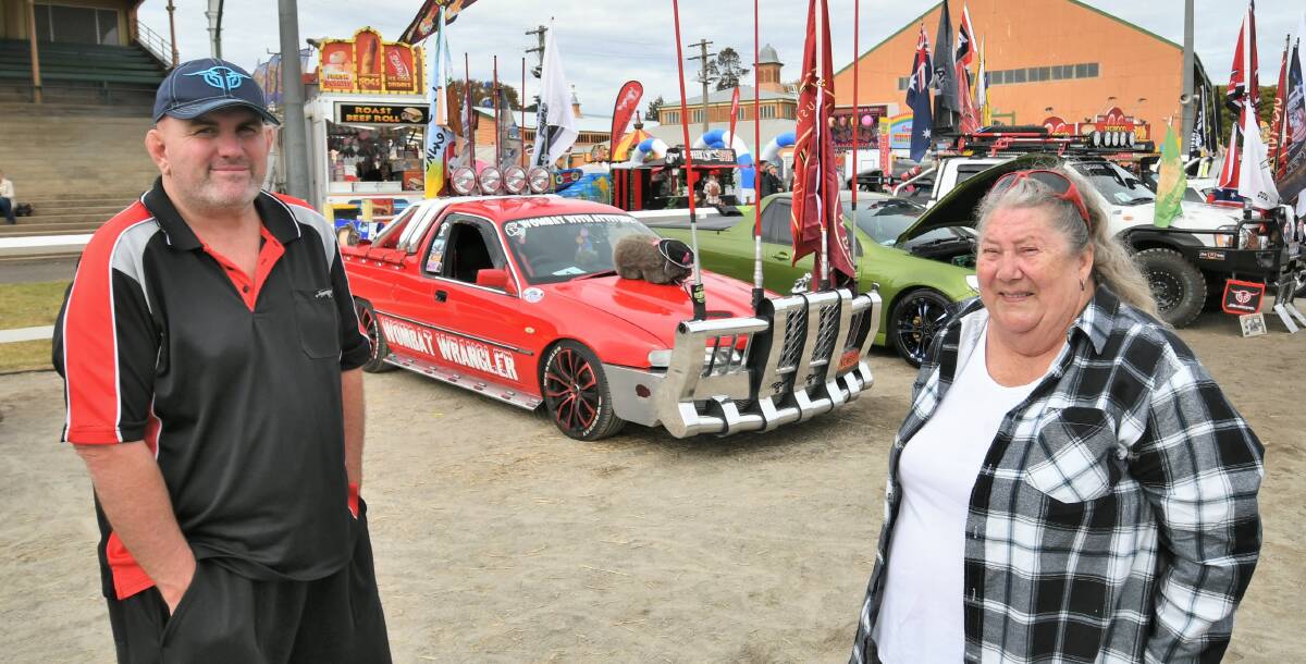 MEAN MACHINE: John and Jenny Ellis with their 1998 VS Holden Commodore ute at the Royal Bathurst Show Ute Muster. Photo: CHRIS SEABROOK 050221cmuster