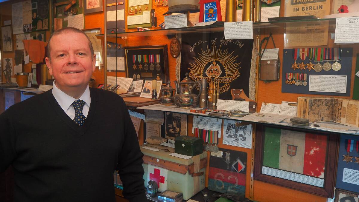 CHANGES TO PROCEEDINGS: Bathurst RSL Club general manager Peter Sargent with a section of war memorabilia on display in the club. Photo: SAM BOLT