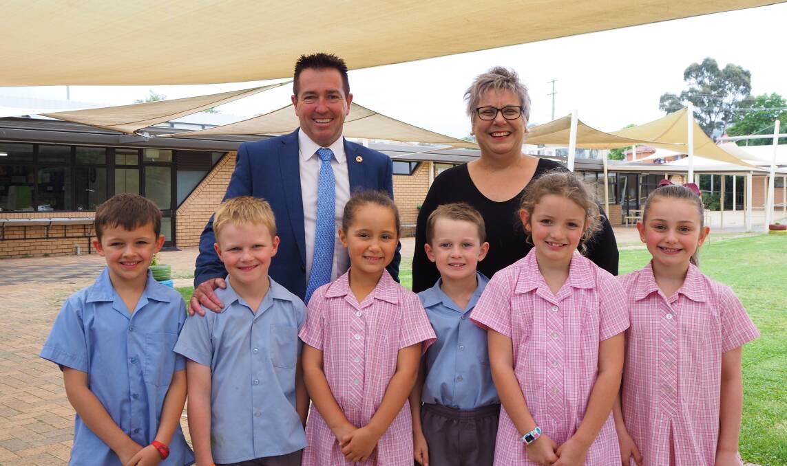 OPEN AIR LEARNING: State Member for Bathurst Paul Toole and St Philomena's School principal Louise Davies with Year 1 students. Photo: SAM BOLT 121118sbstph1