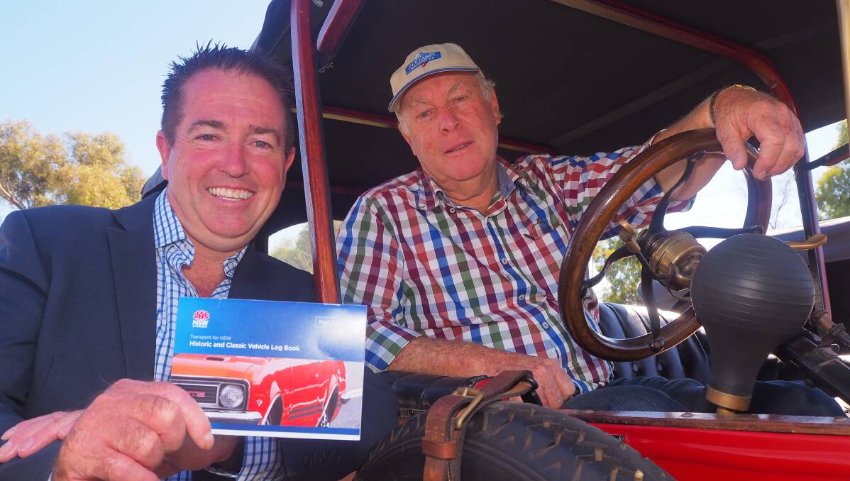 CONVENIENCE: Bathurst MP Paul Toole with Bob Newton at the wheel of his 1914 Model T Ford. Photo: SAM BOLT