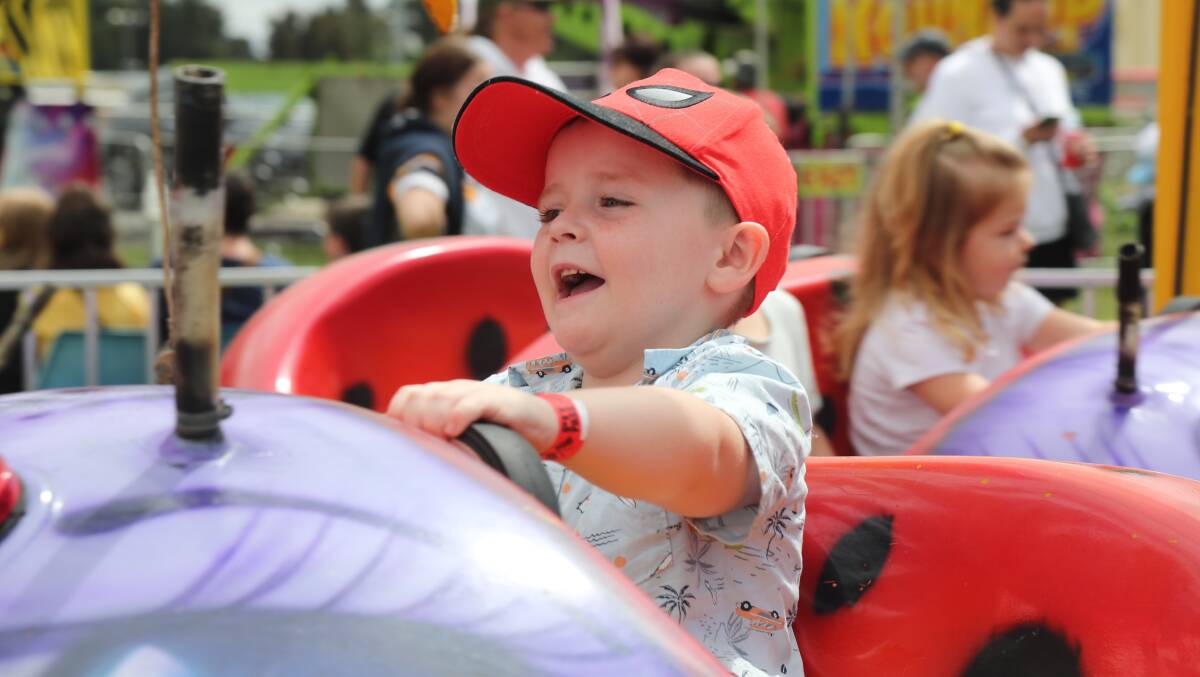 DRIVER'S SEAT: Brooklyn Norman having a ball on one of the amusement rides at the Bathurst Fun Fair on Saturday. Photo: PHIL BLATCH