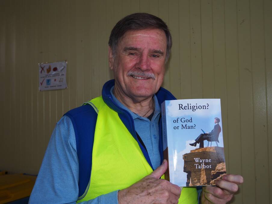 WRITER: Lifeline Central West volunteer Wayne Talbot with one of his published works at last weekend's Mega Book Fair. Photo: SAM BOLT