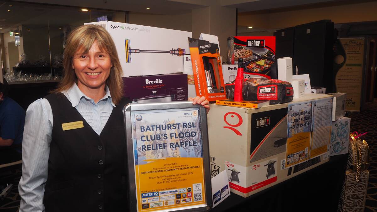 FLOOD AID: Bathurst RSL Club marketing manager Janneke van der Sterren with some of the flood relief online raffle prizes. Photo: SAM BOLT
