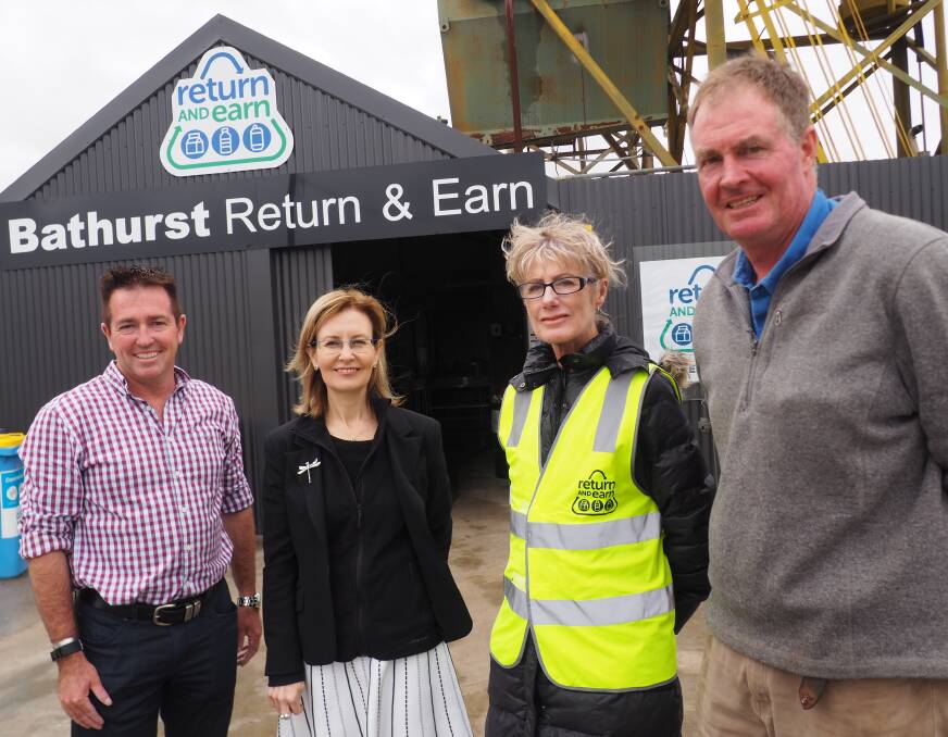 MILLIONS OF ITEMS RETURNED: State member for Bathurst Paul Toole and Minister for the Environment Gabrielle Upton with Bathurst Recycling owners Chris and Craig Clark. Photo: BRIAN WOOD
