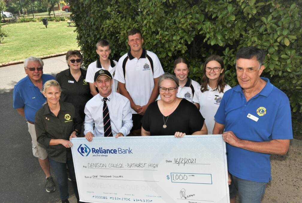 BREAKFAST DONATION: Staff and students from Bathurst High Campus accept a cheque from Lions Club of Bathurst members. Photo: CHRIS SEABROOK 021621clionsdonat