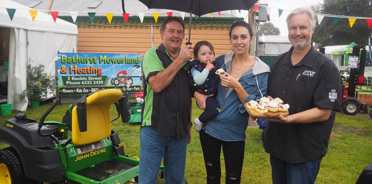 SCONES: Bathurst Mowerland and Heating owner David Morris and Pivot Stove and Heating proprietor Greg Parker-Hill with Sandy and Ivy Connell.