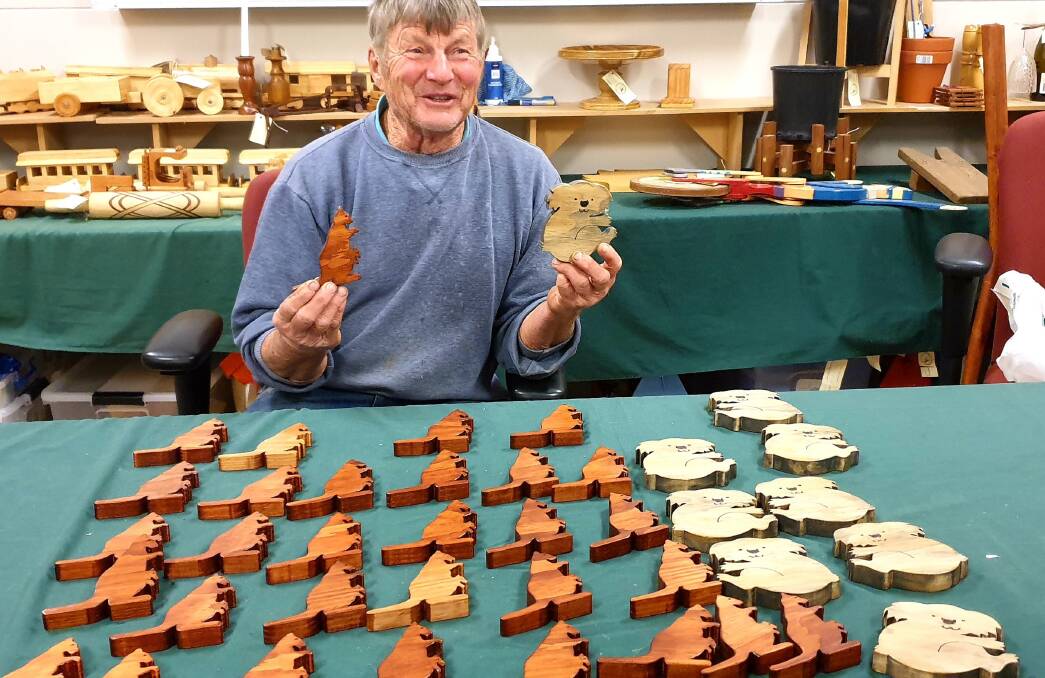 CREATIVE: Central Tablelands Woodcraft member Allan Rintoul with his wooden kangaroos and koalas. Photo: SUPPLIED