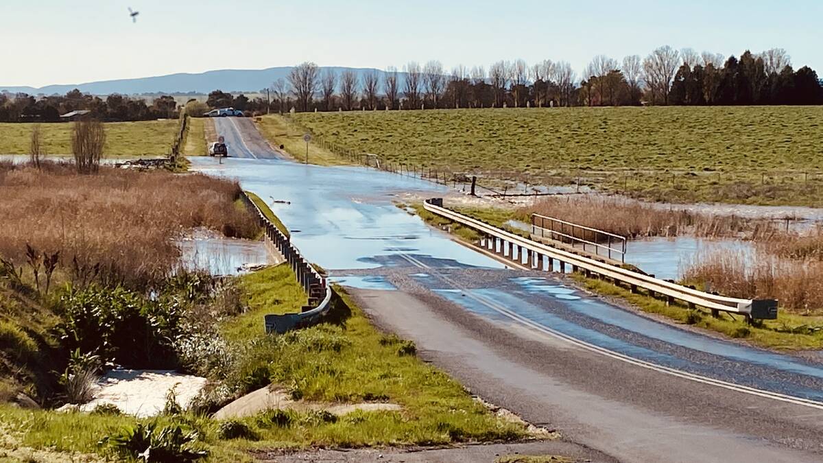 SUBMERGED: Eleven Mile Drive was closed to traffic for half of Tuesday after an overnight storm caused flash flooding around the Saltram Creek catchment area.