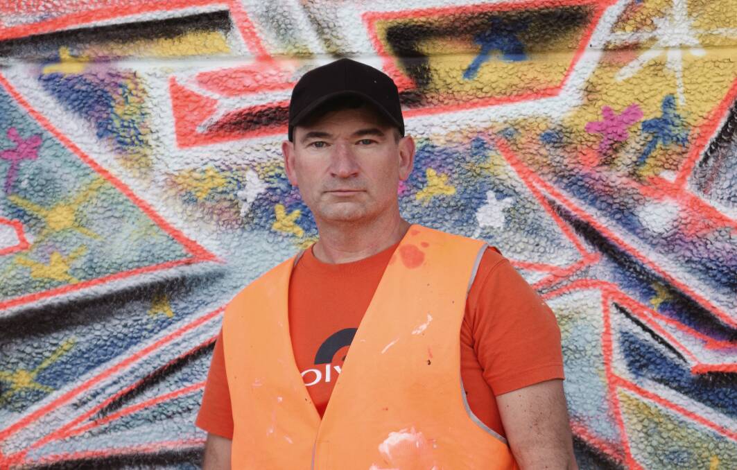 SPRAY SENSATION: Bathurst artist Sven [Stephen Rogers] has been instrumental in the creation of a large-scale graffiti illumination to be beamed onto Keystone 1889 for this year's Bathurst Winter Festival. Photo: SUPPLIED