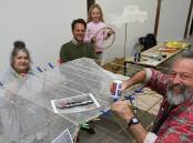 Michelle Graves, Bathurst councillor Jess Jennings with his daughter, Lola and facilitator Phil Relf during a 'Fast Cars and Dirty Beats' lantern workshop last year. Picture: Chris Seabrook