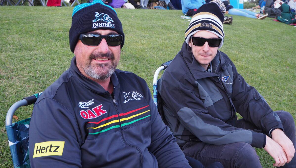 PANTHER PRIDE: Bathurst's Mick and Jayden Burrow showing their support for the Penrith Panthers at last Saturday's game at Carrington Park. Photo: SAM BOLT