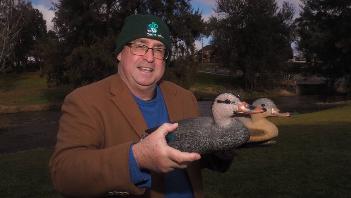Rotary Club of Bathurst Great Corporate Duck Race coordinator Steve Semmens with a couple of the soon-to-be competitors. Picture: Sam Bolt