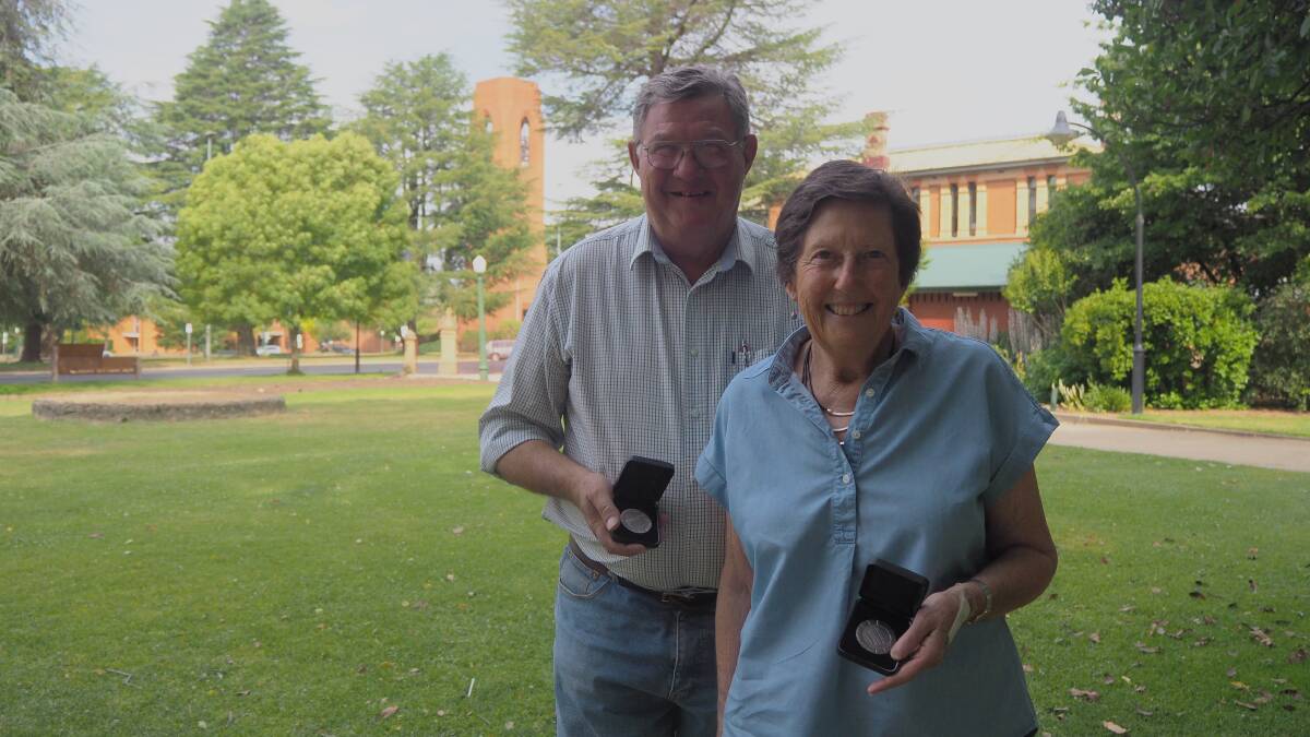 ADVOCATES FOR HISTORY: Bathurst Branch of the National Trust chair Iain McPherson and secretary/treasurer Fran White with Meritorious Service Awards for their ongoing efforts to preserve and promote heritage. Photo: SAM BOLT