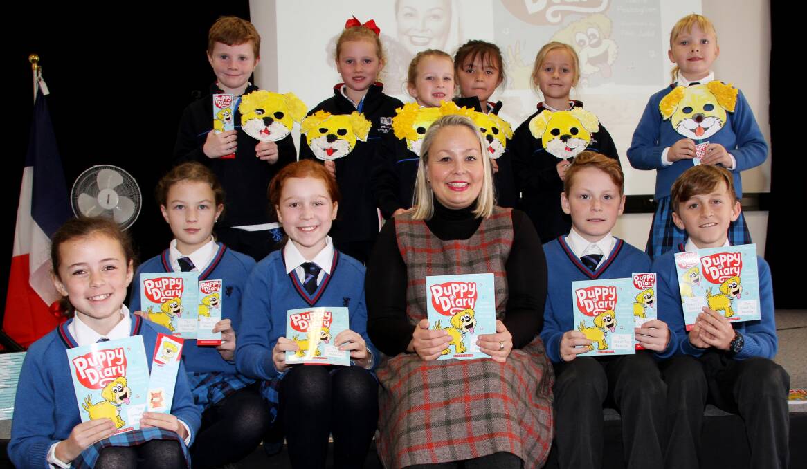 BOOK LAUNCH: Author Yvette Poshoglian with students at Scots All Saints College during the school's Literary Festival. Photo: SUPPLIED