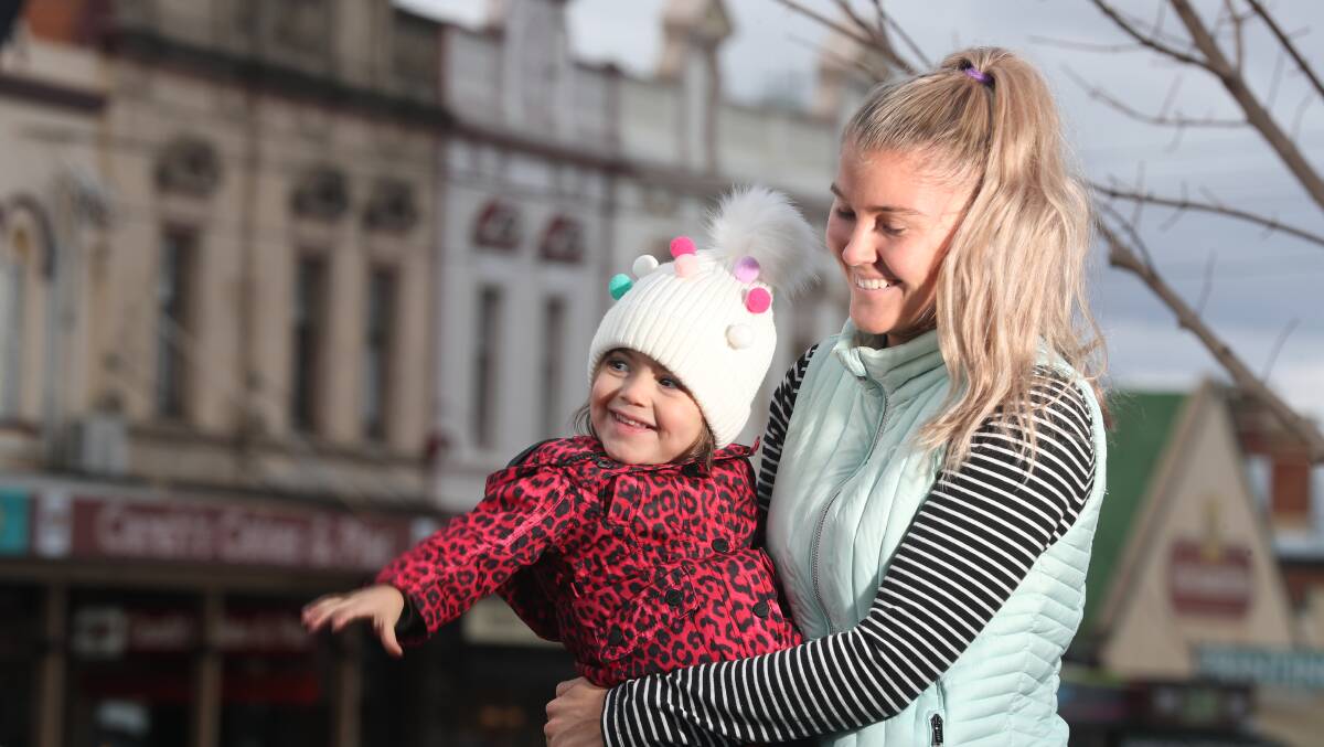 MAKING CONNECTIONS: Community, Health and Lifestyle Movement [CHALM] owner Natalie Cox with daughter Vivienne. Photo: PHIL BLATCH