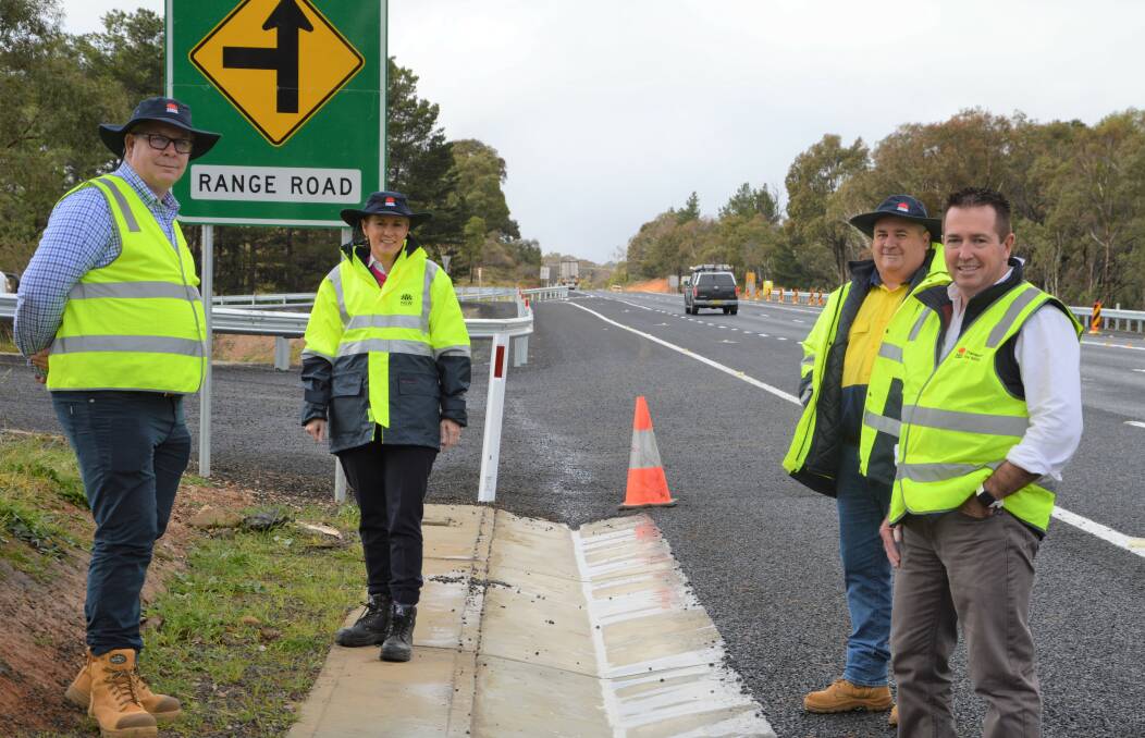 JOB DONE: Bathurst MP Paul Toole [right] at the Range Road intersection where a $2.1 million safety upgrade has just been completed.