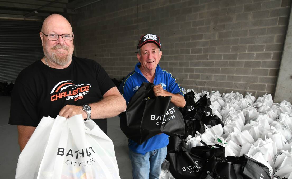 THE GIFT OF GIVING: Christmas Miracle Appeal hamper recipient Shane Hunter with Bathurst mayor Bobby Bourke. Photo: CHRIS SEABROOK