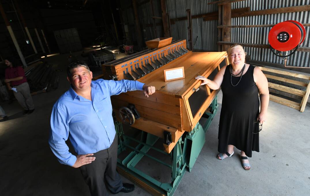 PIECE OF HISTORY: Nestle Purina PetCare Blayney supply chain manager Matthew Bryant and Australian Milling Museum chair Samantha Friend with the donated paddy separator table. Photo:CHRIS SEABROOK 012219cseparatr