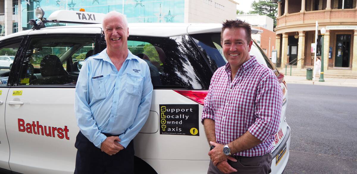 A SAFE TRIP: Bathurst Taxis' Paul Shanahan and State Member for Bathurst Paul Toole unveil the new Support Locally Owned Taxis campaign. Photo: SAM BOLT 122118sbslot1