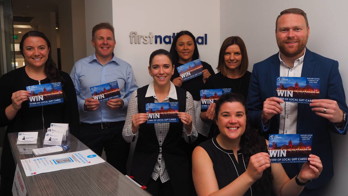 CHRISTMAS CHEER FOR SELLERS: The team at First National Real Estate Bathurst promoting their buy local incentive for property listers. Photo: SAM BOLT