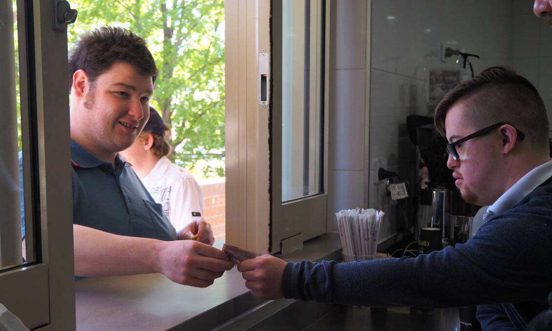 PLACING AN ORDER: A transaction in progress at Cafe on Corporation. Photo: SAM BOLT