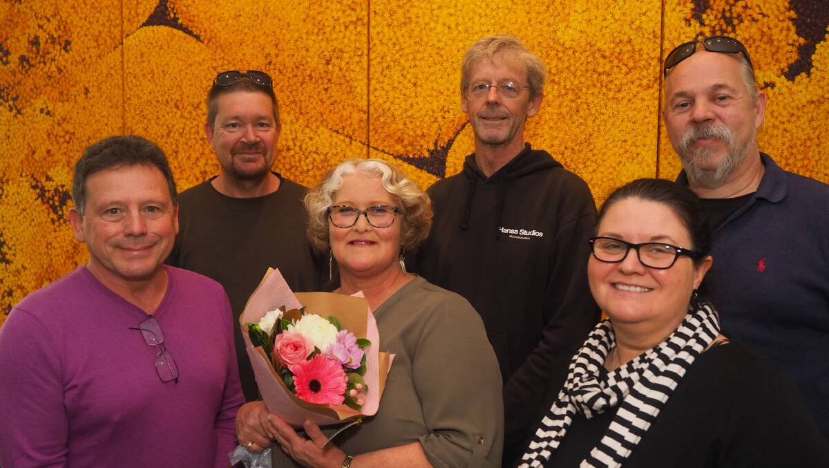 WORKMATES: Outgoing BMCE assistant manager Leonie Smith [centre, with flowers] with long-time colleagues Stephen Champion, Donald Pearce, Tim Roebuck, Kylie Shead and Bannon Rees. Photo: SAM BOLT