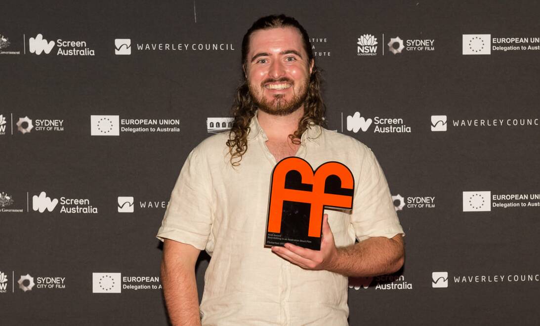 WINNER: Former Bathurst resident Cameron Drew with the award for Best Editing in an Australian Short Film at the Flickerfest 2022 Awards