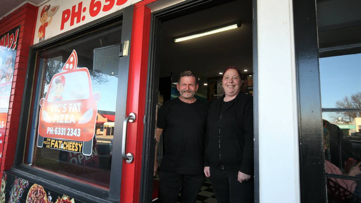 Vic's Fat Pizza owner Vic Issa and manager Rhonda Davis at their Stewart Street store. Photo: PHIL BLATCH
