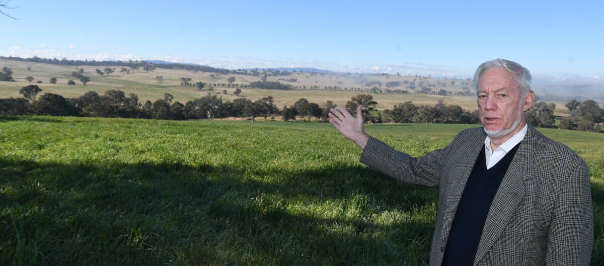 CONCERNED: Lachlan Rendall showing the valley in the middle distance where the intended solar farm is to be placed. Photo:CHRIS SEABROOK 063020csolarfm1
